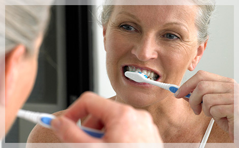 Elderly Woman Brushing Teeth Plaque Build Up parodontax Elderly Woman Brushing Teeth Plaque Build Up parodontax
